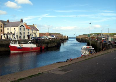 Eyemouth Harbour. The Contented Sole is on the left The Lifeboat docks off to the right